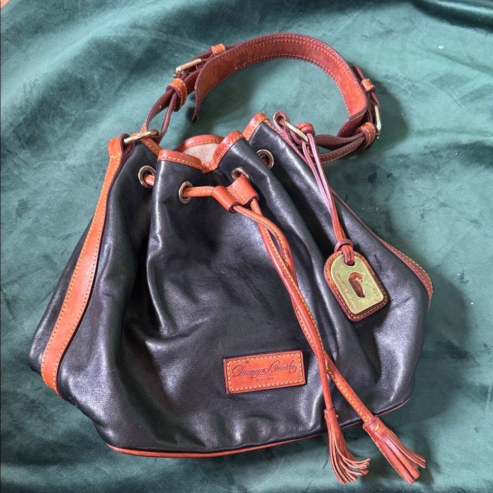 Elegant Dooney & Bourke Black Leather Drawstring Bucket Bag with Brown Trim